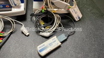 4 x Philips Heartstart XL Defibrillators Including ECG and Printer Options with 4 x Paddle Leads, 4 x Philips M3725A Test Loads and 4 x 3 Lead ECG Leads (All Power Up) *SN US00458261, US00468747, US00578464, US00595806* - 6