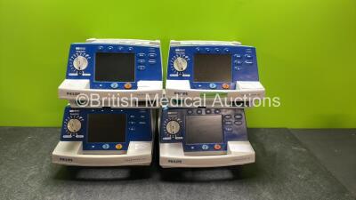 4 x Philips Heartstart XL Defibrillators Including ECG and Printer Options with 4 x Paddle Leads, 4 x Philips M3725A Test Loads and 4 x 3 Lead ECG Leads (3 Power Up, 1 No Power) *SN US00461024, US00601962, US00468997, US00594784*