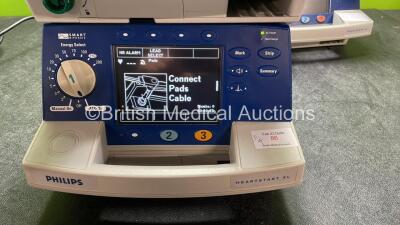 4 x Philips Heartstart XL Defibrillators Including ECG and Printer Options with 4 x Paddle Leads, 4 x Philips M3725A Test Loads and 4 x 3 Lead ECG Leads (3 Power Up, 1 No Power) *SN US00461024, US00601962, US00468997, US00594784* - 2