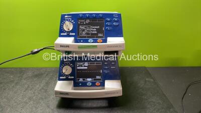 4 x Philips Heartstart XL Defibrillators Including ECG and Printer Options with 4 x Paddle Leads, 4 x Philips M3725A Test Loads and 4 x 3 Lead ECG Leads (3 Power Up, 1 No Power) *SN US00461024, US00601962, US00468997, US00594784* - 3