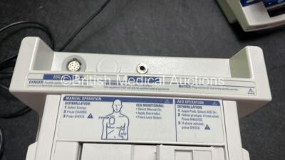 4 x Philips Heartstart XL Defibrillators Including ECG and Printer Options with 4 x Paddle Leads, 4 x Philips M3725A Test Loads and 4 x 3 Lead ECG Leads (3 Power Up, 1 No Power) *SN US00461024, US00601962, US00468997, US00594784* - 4