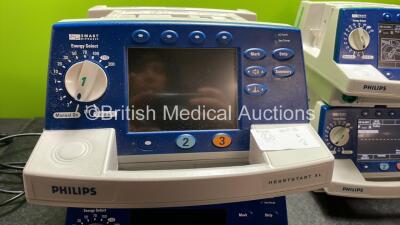 4 x Philips Heartstart XL Defibrillators Including ECG and Printer Options with 4 x Paddle Leads, 4 x Philips M3725A Test Loads and 4 x 3 Lead ECG Leads (3 Power Up, 1 No Power) *SN US00461024, US00601962, US00468997, US00594784* - 5