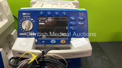 4 x Philips Heartstart XL Defibrillators Including ECG and Printer Options with 4 x Paddle Leads, 4 x Philips M3725A Test Loads and 4 x 3 Lead ECG Leads (All Power Up) *SN US00589288, US00124454, US00583000, US00578468* - 2