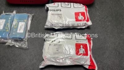 2 x Philips Heartstart HS1 Defibrillators with 4 x Batteries and 4 x Philips REF M5071A Defibrillator Pads *2 Unused* in Carry Cases (Both Power Up) - 5