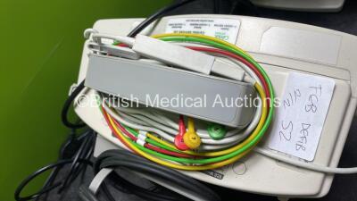 2 x Philips Heartstart MRx Defibrillators Including ECG and Printer Options with 2 x Paddle Leads, 2 x 3 Lead ECG Leads, 2 x Philips M3725A Test Loads and 2 x Philips M3539A Modules (Both Power Up) - 4