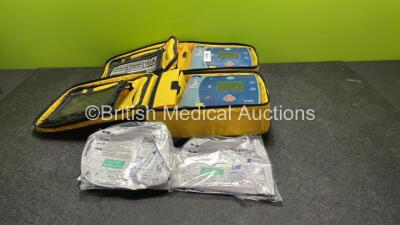 2 x Philips Heartstart FR2+ Defibrillators with 2 x Philips M3863A Batteries *Install Dates 02-2022, 11-2023* 2 x Skintact Electrodes in Carry Bags (Both Power Up and Pass Self Tests) *SN 0905166765, 1110990939*