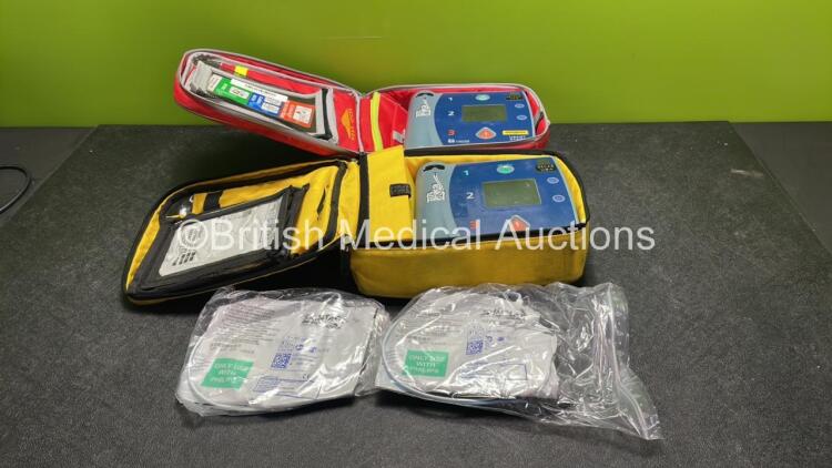 2 x Laerdal Heartstart FR2+ Defibrillators with 2 x Philips M3863A Batteries *Install Dates 02-2022, 06-2024* 2 x Skintact Electrodes in Carry Bags (Both Power Up and Pass Self Tests) *SN 0207223469, 1207267063*