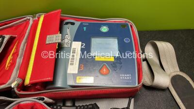 2 x Philips Heartstart FR2+ Defibrillators with 2 x Philips M3863A Batteries *Install Dates 11-2020, 01-2023* 2 x Skintact Electrodes in Carry Bags (Both Power Up and Pass Self Tests) *SN 1207267080, 1110990907* - 2