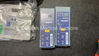 1 x Laerdal Heartstart FR2+ Defibrillator, 1 x Philips Heartstart FR2+ Defibrillator with 2 x Philips M3863A Batteries *Install Dates 11-2025, 01-2023* 2 x Skintact Electrodes in Carry Bags (Both Power Up and Pass Self Tests) *SN 0411890705, 1007258750* - 3