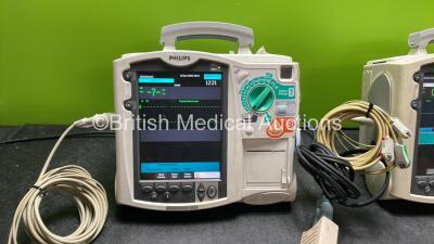 2 x Philips Heartstart MRx Defibrillators Including Pacer, ECG and Printer Options with 2 x Philips M3539A Modules, 1 x Philips M3538A Batteries, 2 x Paddle Leads, 2 x Skintact Electrodes *Both In Date* 2 x 3 Lead ECG Leads and 2 x Philips M3725A Test Loa - 3