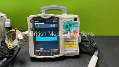 2 x Philips Heartstart MRx Defibrillators Including Pacer, ECG and Printer Options with 2 x Philips M3539A Modules, 1 x Philips M3538A Batteries, 2 x Paddle Leads, 2 x Skintact Electrodes *Both In Date* 2 x 3 Lead ECG Leads and 2 x Philips M3725A Test Loa - 4