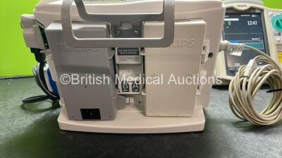 2 x Philips Heartstart MRx Defibrillators Including Pacer, ECG and Printer Options with 2 x Philips M3539A Modules, 1 x Philips M3538A Batteries, 2 x Paddle Leads, 2 x Skintact Electrodes *Both In Date* 2 x 3 Lead ECG Leads and 2 x Philips M3725A Test Loa - 6