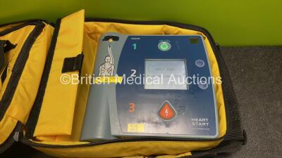 2 x Philips Heartstart FR2+ Defibrillators with 2 x Philips M3863A Batteries *Install Dates 11-2025, 11-2023* 2 x Skintact Electrodes in Carry Bags (Both Power Up and Pass Self Tests) *SN 0411890746, 1010990296* - 2