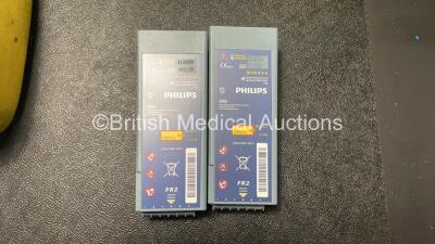 2 x Philips Heartstart FR2+ Defibrillators with 2 x Philips M3863A Batteries *Install Dates 11-2025, 11-2023* 2 x Skintact Electrodes in Carry Bags (Both Power Up and Pass Self Tests) *SN 0411890746, 1010990296* - 3