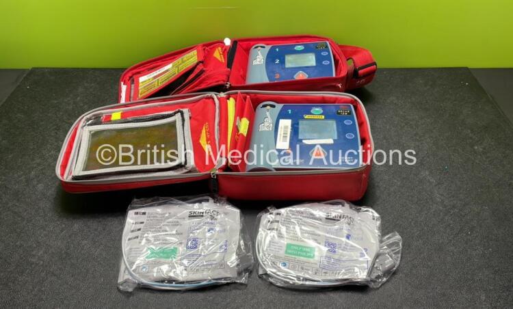 2 x Laerdal Heartstart FR2+ Defibrillators with 2 x Philips M3863A Batteries *Install Dates 10-2021, 02-2022* 2 x Skintact Electrodes in Carry Bags (Both Power Up and Pass Self Tests) *SN 0207225980, 0207223925*