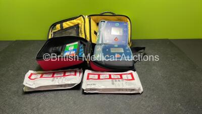 Job Lot Including 1 x Philips Heartstart FR2+ Defibrillator, 1 x Laerdal Heartstart FR2+ Defibrillator with 2 x Philips M3863A Batteries *Install Dates 04-2023, 09-2022* 4 x Philips Electrode Pads *All Out of Date* 2 x Carry Bags (Both Power Up and Passe