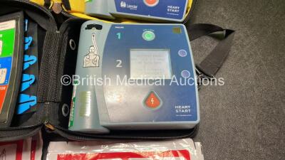 Job Lot Including 1 x Philips Heartstart FR2+ Defibrillator, 1 x Laerdal Heartstart FR2+ Defibrillator with 2 x Philips M3863A Batteries *Install Dates 04-2023, 09-2022* 4 x Philips Electrode Pads *All Out of Date* 2 x Carry Bags (Both Power Up and Passe - 3