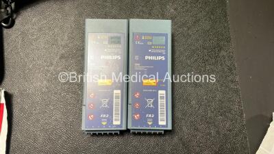 Job Lot Including 1 x Philips Heartstart FR2+ Defibrillator, 1 x Laerdal Heartstart FR2+ Defibrillator with 2 x Philips M3863A Batteries *Install Dates 04-2023, 09-2022* 4 x Philips Electrode Pads *All Out of Date* 2 x Carry Bags (Both Power Up and Passe - 5