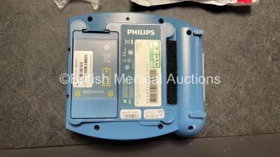 2 x Philips Heartstart HS1 Defibrillators with 4 x Batteries and 4 x Philips REF M5071A Defibrillator Pads *2 Unused* in Carry Cases (Both Power Up) - 5