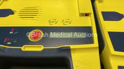 3 x Cardiac Science Powerheart AED G3 Defibrillator with 3 x Batteries (All Power Up, 1 with Faulty Display- See Photo) - 3