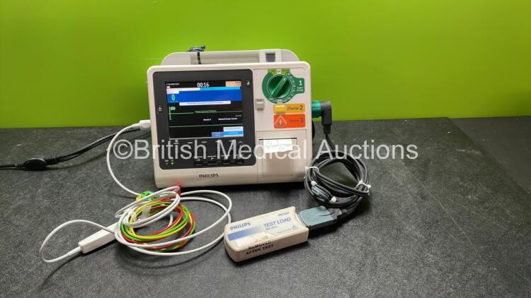 Philips Heartstart XL+ Defibrillator Including ECG and Printer Options with 1 x Paddle Lead, 1 x Philips M3725A Test Load and 1 x 3 Lead ECG Lead (Powers Up) *Mfd 04-2014* *SN US41412211*