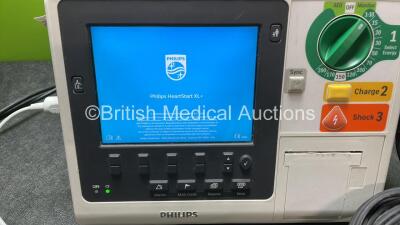 Philips Heartstart XL+ Defibrillator Including ECG and Printer Options with 1 x Paddle Lead, 1 x Philips M3725A Test Load and 1 x 3 Lead ECG Lead (Powers Up) *Mfd 04-2014* *SN US41412211* - 2