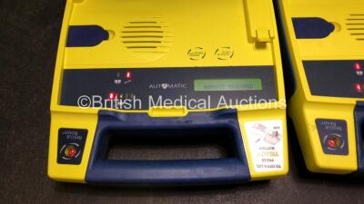 4 x Cardiac Science Powerheart AED G3 Defibrillators (All Power Up with Stock Battery, Batteries Not Included, 1 x Requires Service) - 4