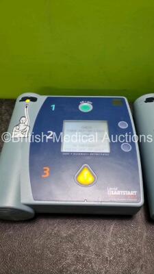 Job Lot Including 1 x Laerdal Heartstart FR2 Defibrillator (Powers Up and Passes Self Test) 1 x Laerdal Heartstart FR2+ Defibrillator (Powers Up and Failed Self Test) and 2 x Philips M3863A Batteries *Install Before 07-2019 / 10-2024* - 2