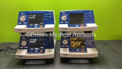 4 x Philips Heartstart XL Defibrillators Including ECG and Printer Options with 4 x Paddle Leads, 4 x Philips M3725A Test Loads and 4 x 3 Lead ECG Leads (All Power Up) *SN US00578463, US00591365, US00588705, US00117258*