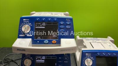 4 x Philips Heartstart XL Defibrillators Including ECG and Printer Options with 4 x Paddle Leads, 4 x Philips M3725A Test Loads and 4 x 3 Lead ECG Leads (All Power Up) *SN US00578463, US00591365, US00588705, US00117258* - 5