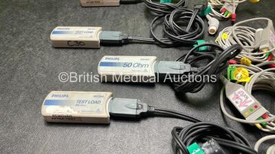 4 x Philips Heartstart XL Defibrillators Including ECG and Printer Options with 4 x Paddle Leads, 4 x Philips M3725A Test Loads and 4 x 3 Lead ECG Leads (All Power Up) *SN US00578463, US00591365, US00588705, US00117258* - 6