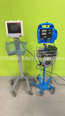 1 x Datascope Trio Patient Monitor on Stand and 1 x GE Dinamap ProCare Auscultatory 400 Vital Signs Monitor on Stand (Both Power Up - 1 x Damaged / Incomplete - See Pictures) *S/N MC06090-G4*