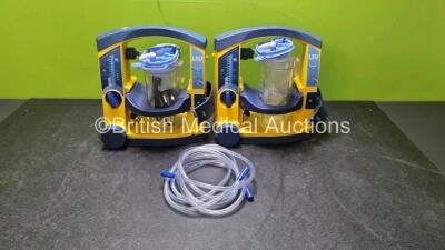 2 x Laerdal LSU Suction Units (Both Power up 1 x with Damage to Casing - See Photo) with 2 x Suction Cups and 2 x Hoses