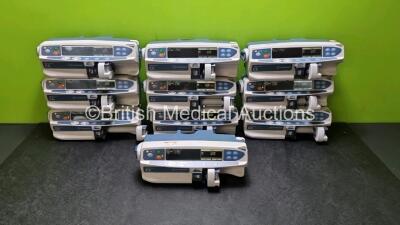 Job Lot Including 10 x Carefusion Alaris Plus CC Syringe Pumps (All Power Up) and 2x Carefusion Alaris DS Docking Stations *SN 135039249 / 135041096 / 135039243 / 135039233 / 135041097 / 135039250 / 135041098 / 135041070 / 135039240 / 135041082* (cage)