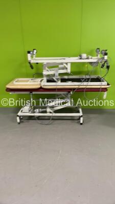 2 x Huntleigh Electric Patient Examination Couches with Controllers (Both Power Up) *S/N 09678 / 09858*