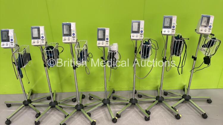 7 x Omron HEM-907 Digital Blood Pressure Monitors on Stands with Hoses and Cuffs ( All Power Up) *S/N 58000003AF / 20100400200AF / 20100100298AF / 20100400599AF / 20100400297AF / 20100100582AF / 20100200461AF*