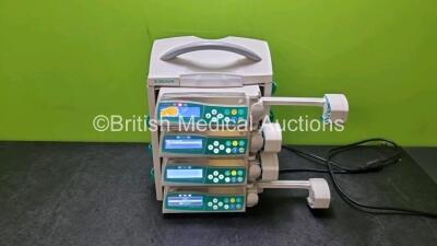 4 x B Braun Perfusor Space Syringe Pumps with 1 x B.Braun Space Docking Station (All Power Up with 1 x Damaged Display and 1 x Blank Screen) *SN 98090 / 97691 / 97654 / 45240*