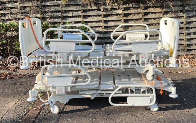 11 x Electric Hospital Beds with Controllers (2 in Photo, 11 Total in Lot)