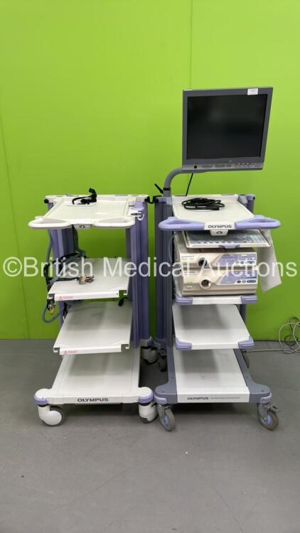 2 x Olympus Stack Trolleys with 1 x Olympus OEV181H Monitor, Keyboard, Olympus Evis Lucera CV-260 and Olympus Evis Lucera CLV-260 (All Power Up) *7321628 / 7525501 / 7514958*