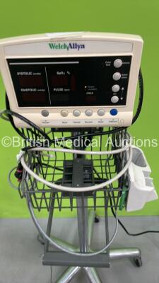 Mixed Lot Including 1 x Welch Allyn 53NT00 Vital Signs Monitor on Stand, 1 x Welch Allyn 5200 Series Vital Signs Monitor on Stand,(Both Power Up) 1 x Walking Aid, 1 x RDP Mobile Workstation and 1 x Arjo Manual Standing Aid *S/N JA122168* - 6