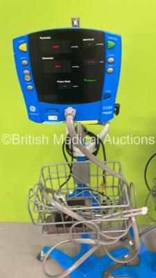 1 x GE Dinamap Carescape V100 Vital Signs Monitor on Stand, 1 x GE Dinamap ProCare Auscultatory Vital Signs Monitor on Stand and 1 x GE Dinamap ProCare Auscultatory 400 Vital Signs Monitor on Stand (All Power Up - 1 x Missing Wheel) *S/N SDT10490683SA* - 2