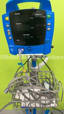 1 x GE Dinamap Carescape V100 Vital Signs Monitor on Stand, 1 x GE Dinamap ProCare Auscultatory Vital Signs Monitor on Stand and 1 x GE Dinamap ProCare Auscultatory 400 Vital Signs Monitor on Stand (All Power Up - 1 x Missing Wheel) *S/N SDT10490683SA* - 4