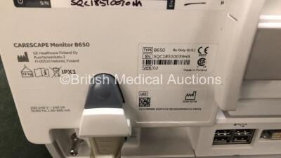 GE Carescape B650 Touch Screen Patient Monitor *Mfd - 2019* with 1 x GE Dinamap Ref- 2016793-002 Patient Data Module Including ECG, Temp/CO, P1/P3, P2/P4, SpO2 and NIBP Options *Mfd 2019* (Both Power Up - In Excellent Condition Like New in Box) **SN SPX19 - 6