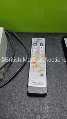 Job Lot of Operating Table Remotes Including 1 x Maquet 3113.1269, 1 x Maquet 1133.91A0 with 2 x Maquet 34310.26A0 Wireless Controller Chargers (Both Power Up) and 1 x Maquet 311.30D9 / 01442 - 2