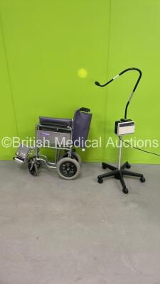 1 x Welch Allyn Examination Light (Powers Up) and 1 x InvaMed Wheelchair (Flat Tyre)