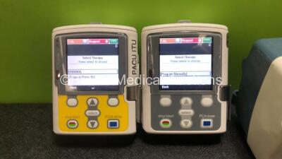 Job Lot Including 2 x Smiths Medical CADD Model 2110 Ambulatory Infusion Pumps with 1 x Power Supply and 2 x Pole Mount Adapters (Both Power Up) and 1 x CareFusion Alaris PK Syringe Pump (Powers Up with Faulty Screen - See Photos) *SN 1066778 / 1066574 / - 2