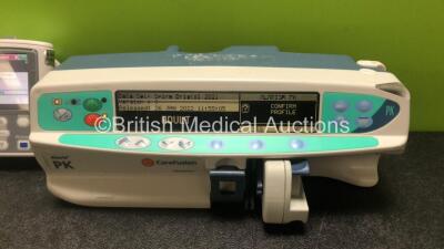 Job Lot Including 2 x Smiths Medical CADD Model 2110 Ambulatory Infusion Pumps with 1 x Power Supply and 2 x Pole Mount Adapters (Both Power Up) and 1 x CareFusion Alaris PK Syringe Pump (Powers Up with Faulty Screen - See Photos) *SN 1066778 / 1066574 / - 3