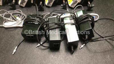 4 x Smiths Medical CADD Model 2110 Ambulatory Infusion Pumps with 4 x Power Supplies, 4 x Pole Mount Adapters, 4 x Pole Mount Brackets and 3 x Controls (All Power Up) *SN 1066779 / 1066782 / 1066781 / 1066780* - 6