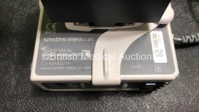 4 x Smiths Medical CADD Model 2110 Ambulatory Infusion Pumps with 4 x Power Supplies, 4 x Pole Mount Adapters, 4 x Pole Mount Brackets and 3 x Controls (All Power Up) *SN 1066779 / 1066782 / 1066781 / 1066780* - 7