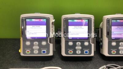 4 x Smiths Medical CADD Model 2110 Ambulatory Infusion Pumps with 4 x Power Supplies, 4 x Pole Mount Adapters, 4 x Pole Mount Brackets and 3 x Controls (All Power Up) *SN 1066492 / 1066487 / 1066698 / 1066704* - 2